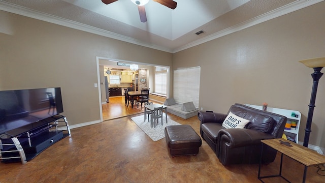 living room with crown molding, concrete floors, a ceiling fan, baseboards, and visible vents