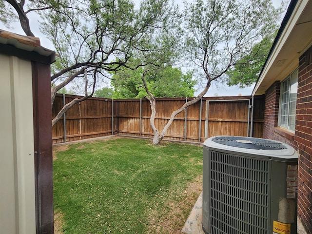 view of yard featuring cooling unit and a fenced backyard