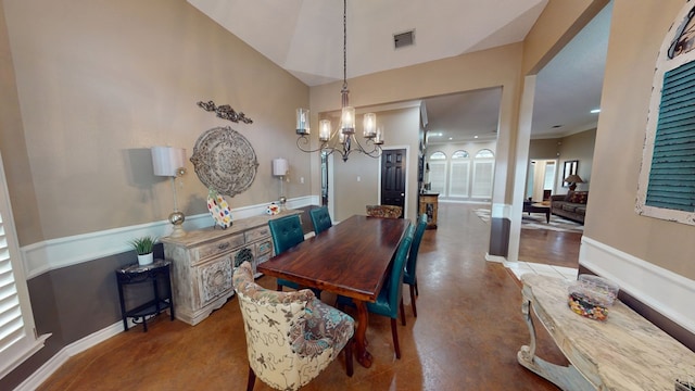 dining room with baseboards, a chandelier, and visible vents