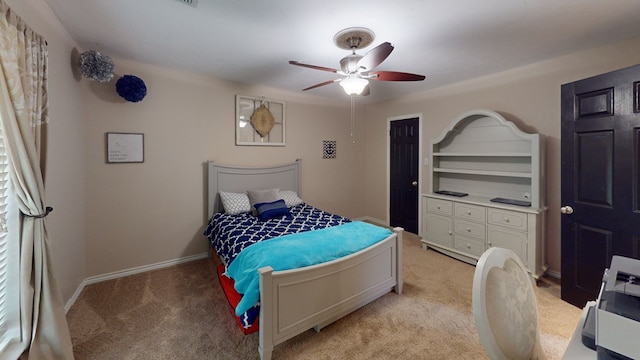 bedroom with baseboards, ceiling fan, and light colored carpet