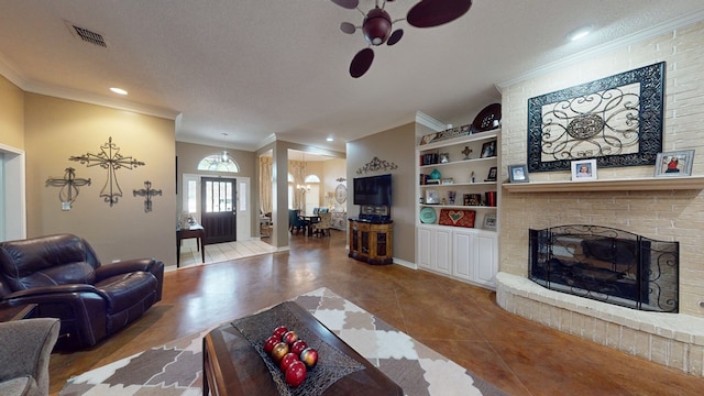 living room featuring crown molding, a brick fireplace, recessed lighting, baseboards, and visible vents