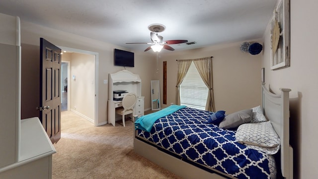 bedroom with visible vents, ceiling fan, and light colored carpet