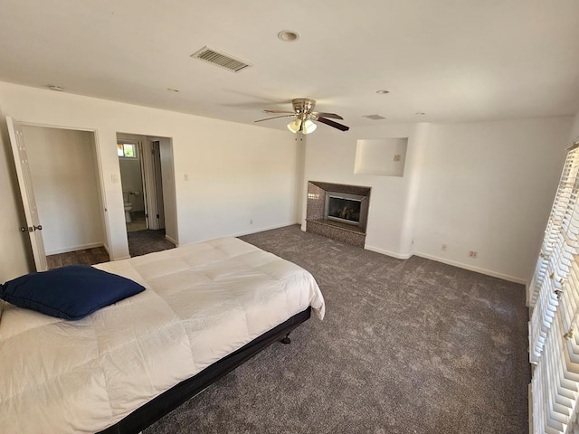 bedroom with dark colored carpet and ceiling fan