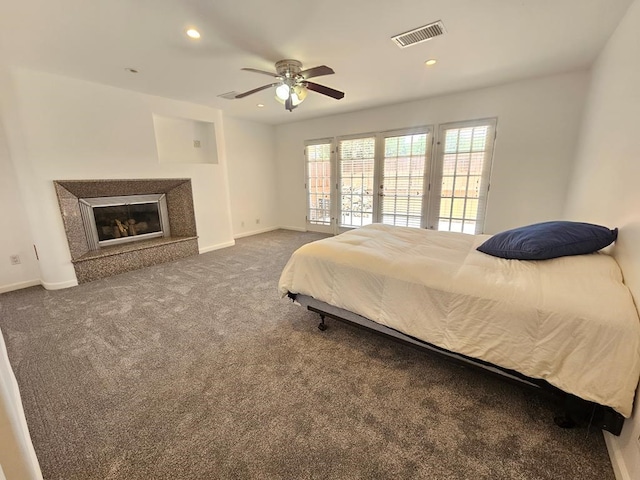 carpeted bedroom featuring ceiling fan