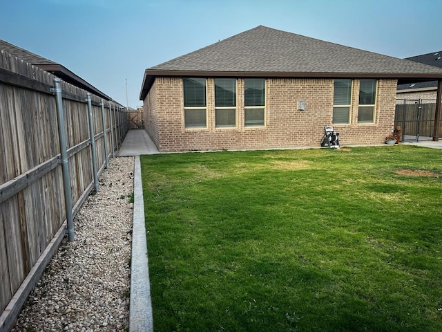 607 Foggy Bottom Ct, Midland, TX 79706 - back of property with brick siding and roof with shingles
