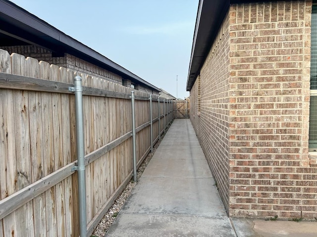 607 Foggy Bottom Ct, Midland, TX 79706 - view of property exterior with fence and brick siding