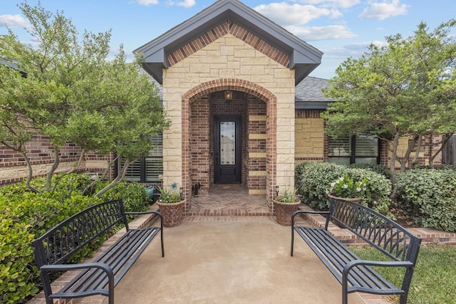 property entrance with a patio area