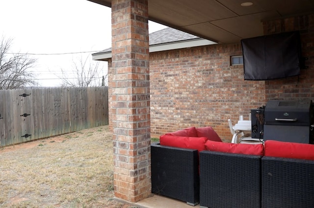 view of patio with fence and an outdoor living space