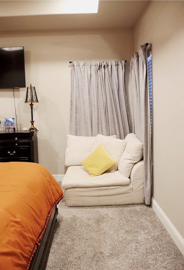 bedroom with carpet and baseboards