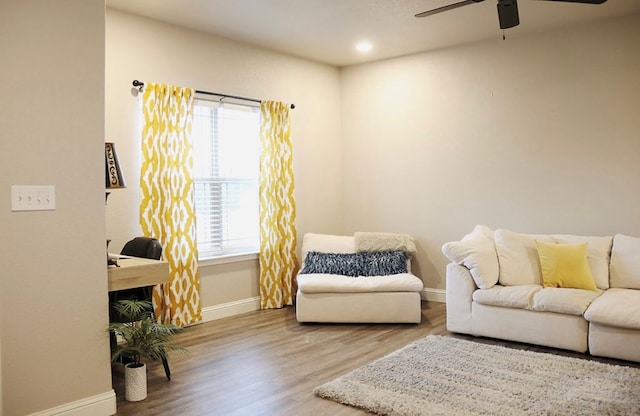 living room with ceiling fan, recessed lighting, wood finished floors, and baseboards