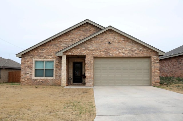 single story home with a garage, driveway, and brick siding