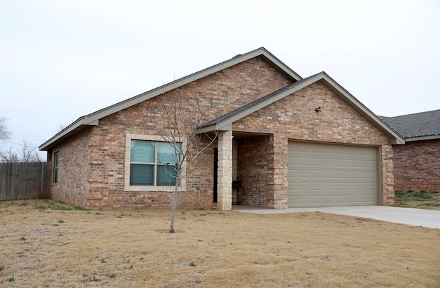 ranch-style home with a garage, brick siding, concrete driveway, fence, and a front yard