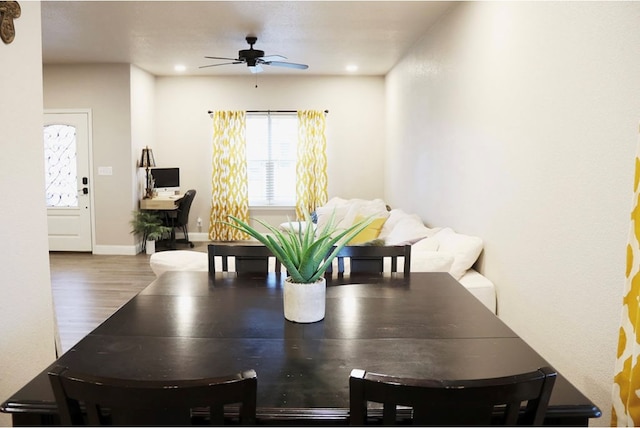 dining room featuring a ceiling fan, recessed lighting, baseboards, and wood finished floors