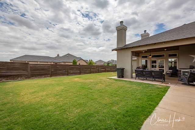 5300 Balfour Ct, Midland, TX 79707 - fenced backyard featuring a patio area, a ceiling fan, and an outdoor hangout area