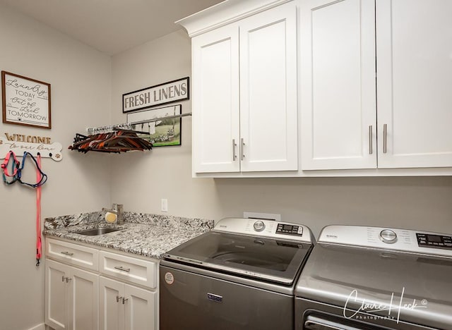 5300 Balfour Ct, Midland, TX 79707 - laundry room with cabinet space and washing machine and clothes dryer