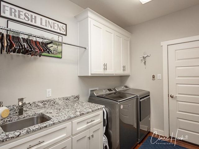 5300 Balfour Ct, Midland, TX 79707 - laundry area with cabinet space, independent washer and dryer, and dark wood finished floors