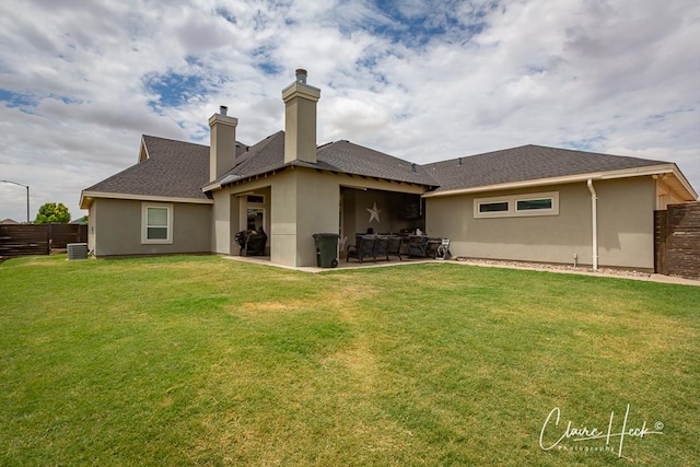 5300 Balfour Ct, Midland, TX 79707 - back of property featuring stucco siding, a patio, a chimney, and a shingled roof
