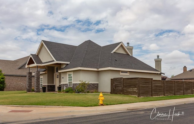 5300 Balfour Ct, Midland, TX 79707 - view of front of property featuring stucco siding, stone siding, and roof with shingles
