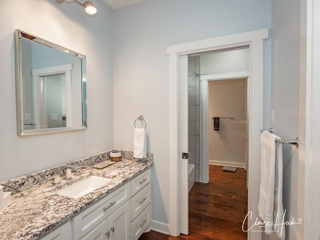 5300 Balfour Ct, Midland, TX 79707 - full bath featuring vanity, wood finished floors, and  shower combination