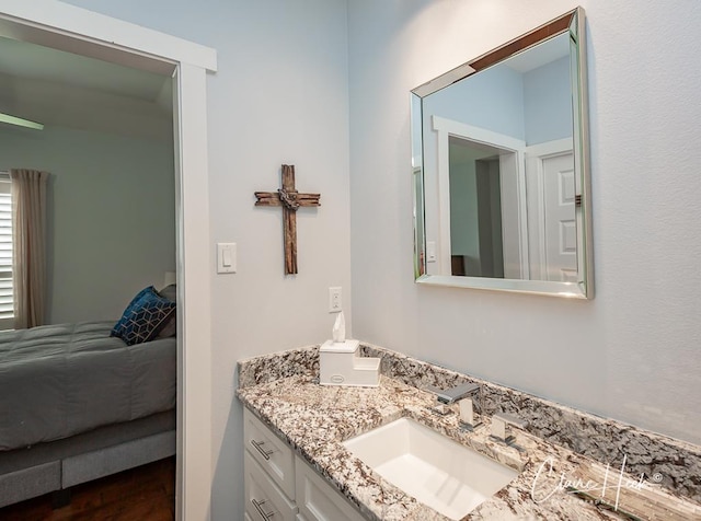5300 Balfour Ct, Midland, TX 79707 - ensuite bathroom with vanity and wood finished floors