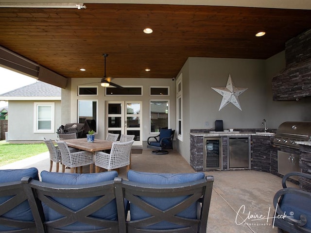 5300 Balfour Ct, Midland, TX 79707 - view of patio featuring exterior kitchen, a ceiling fan, outdoor dining space, and beverage cooler