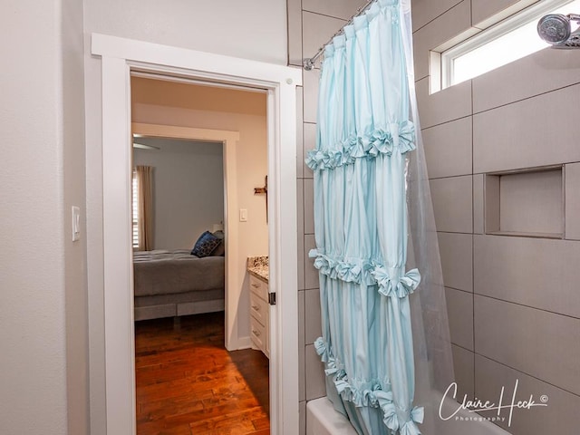 5300 Balfour Ct, Midland, TX 79707 - ensuite bathroom featuring wood finished floors, shower / bath combo, and vanity
