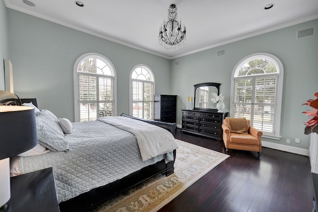 bedroom with ornamental molding, dark wood-type flooring, baseboards, and visible vents