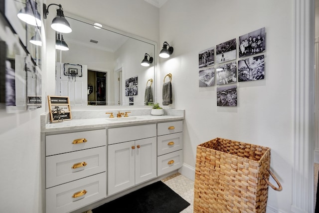 bathroom featuring vanity, visible vents, and crown molding
