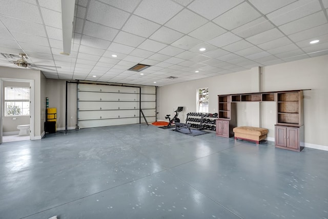 garage featuring baseboards and recessed lighting