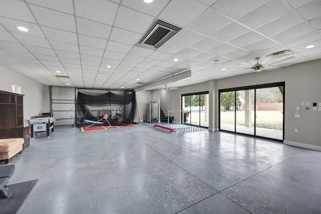 interior space with a ceiling fan, baseboards, and visible vents