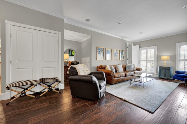 living room featuring dark wood-style floors and crown molding
