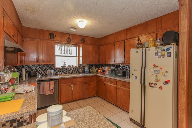 kitchen with sink, dishwasher, white refrigerator, backsplash, and light tile patterned floors