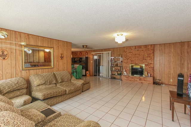 tiled living room with wood walls and a textured ceiling