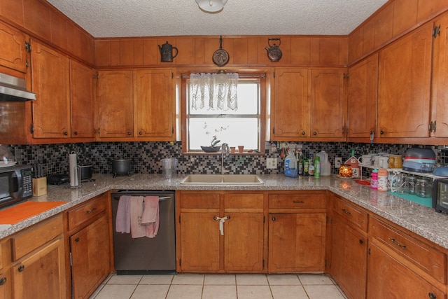 kitchen featuring decorative backsplash, a textured ceiling, sink, light tile patterned floors, and dishwasher