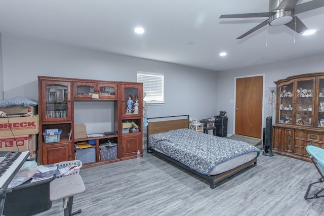 bedroom featuring ceiling fan and light hardwood / wood-style flooring