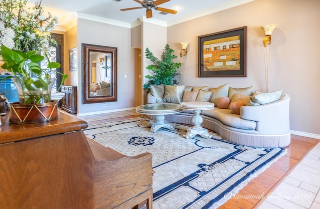 living room featuring ceiling fan, hardwood / wood-style floors, and crown molding