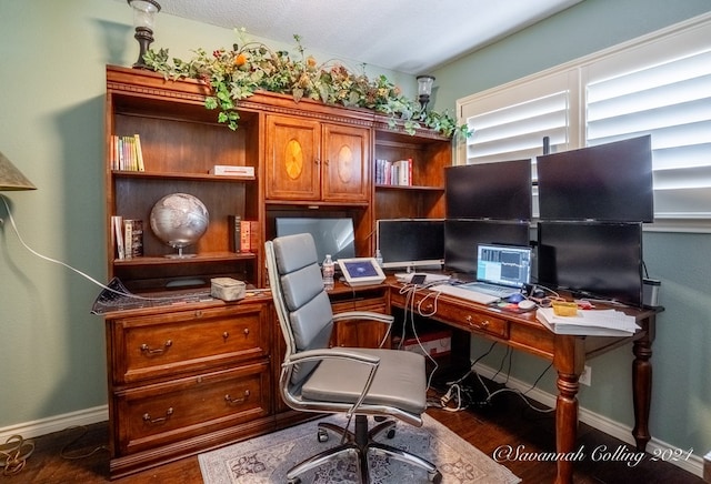 office space with dark wood-type flooring and a textured ceiling