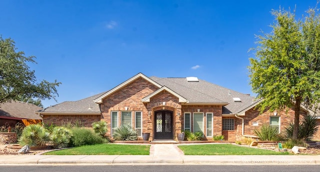 view of front of home with a front lawn