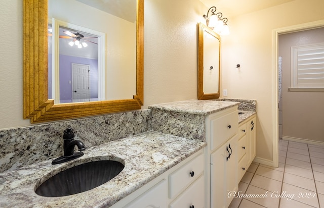 bathroom featuring tile patterned flooring, vanity, and ceiling fan