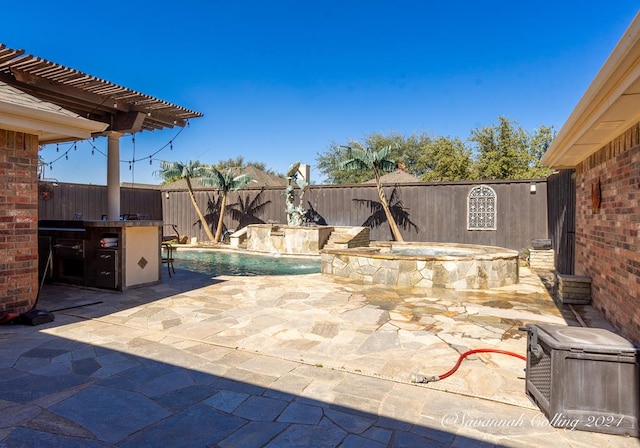 view of patio with pool water feature and a pool with hot tub