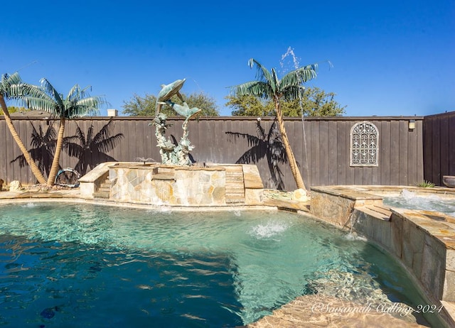 view of swimming pool featuring pool water feature