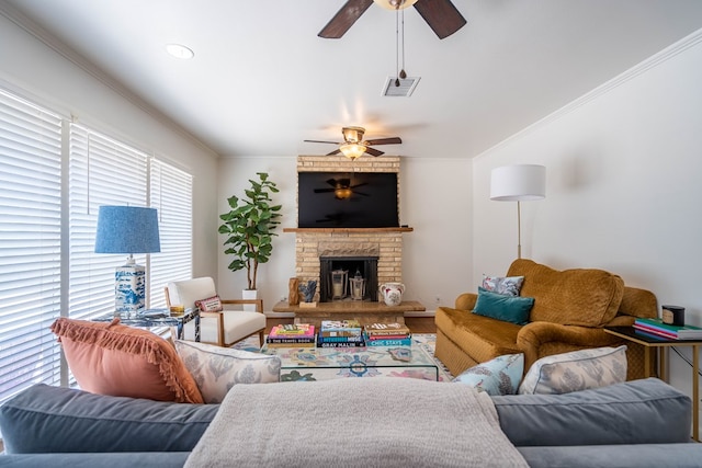 2209 Shell Ave, Midland, TX 79705 - living room with ceiling fan, crown molding, a fireplace, and wood finished floors