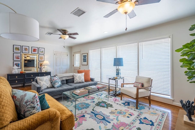 2209 Shell Ave, Midland, TX 79705 - living room featuring ceiling fan, wood finished floors, baseboards, and crown molding