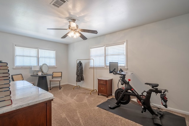 2209 Shell Ave, Midland, TX 79705 - workout area featuring light colored carpet, ceiling fan, and baseboards
