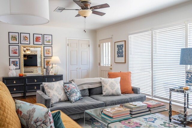 2209 Shell Ave, Midland, TX 79705 - living room with a ceiling fan, wood finished floors, and ornamental molding