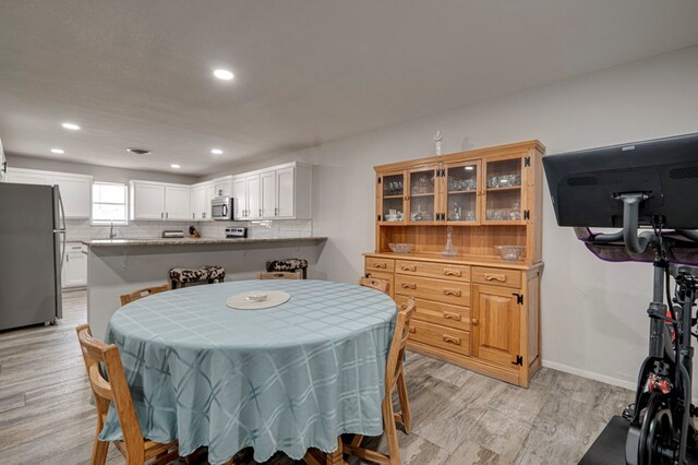 4003 Angelina Dr, Midland, TX 79705 - dining room with light wood finished floors, recessed lighting, and baseboards