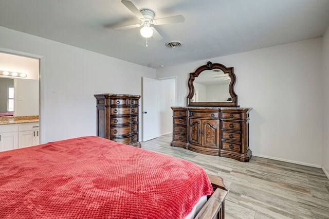 4003 Angelina Dr, Midland, TX 79705 - bedroom with light wood-style flooring, ensuite bath, a ceiling fan, and baseboards