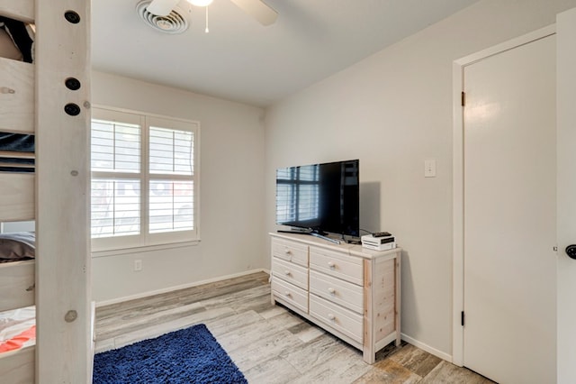 4003 Angelina Dr, Midland, TX 79705 - bedroom with light wood-type flooring, ceiling fan, and baseboards