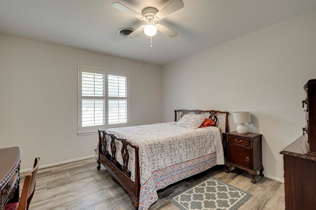 4003 Angelina Dr, Midland, TX 79705 - bedroom with light wood-style flooring, baseboards, and ceiling fan