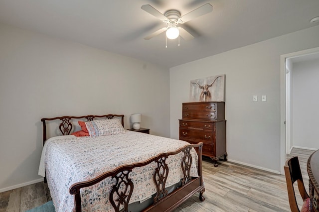 4003 Angelina Dr, Midland, TX 79705 - bedroom with light wood-style floors, baseboards, and a ceiling fan